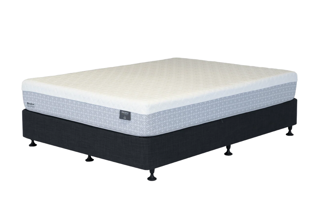 A Sleepyhead mattress on a dark upholstered bed base with small feet, shown on a plain white background. The mattress has a quilted cream top and a light gray patterned side panel, with a small visible brand tag on the side.