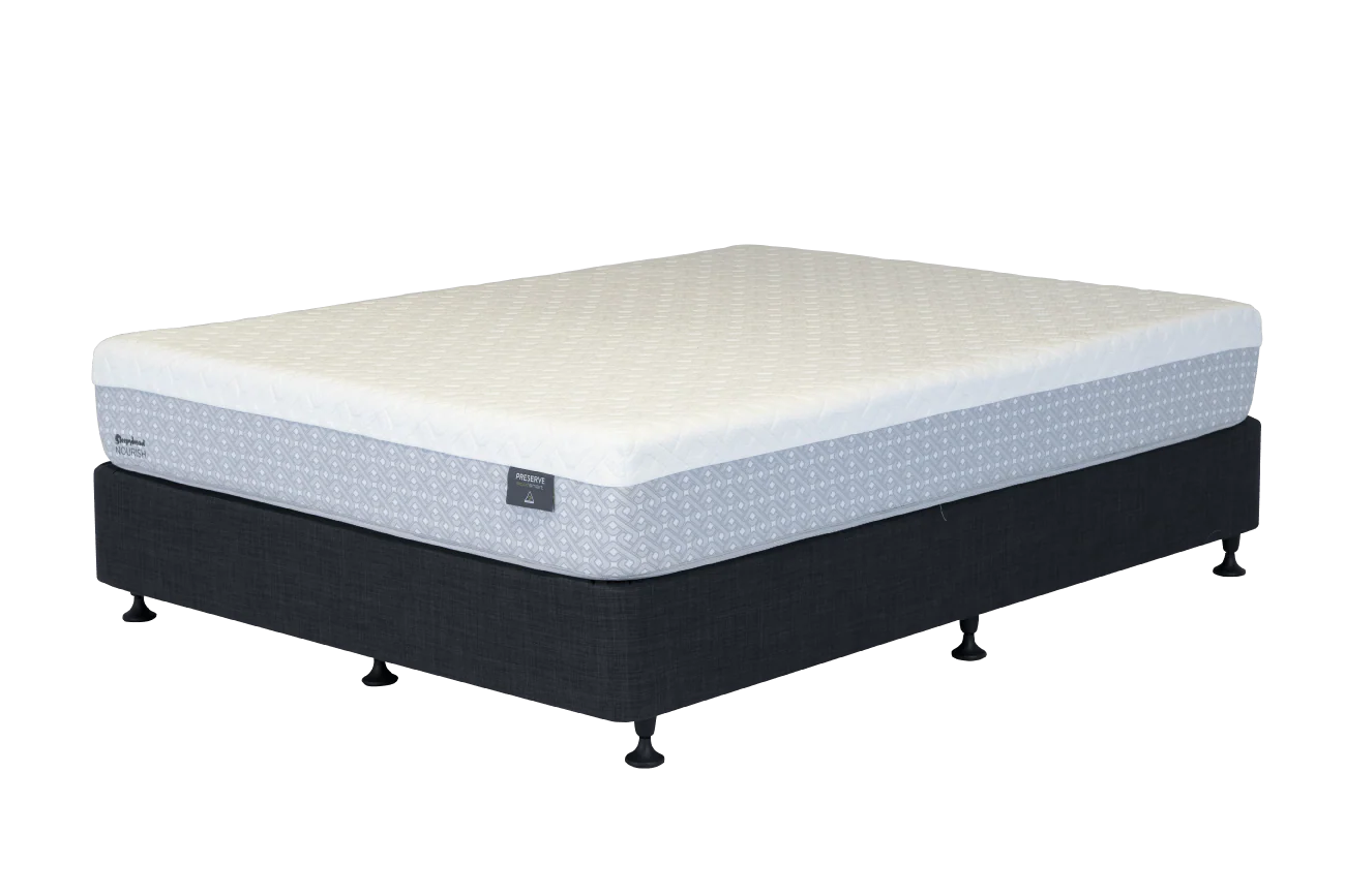 A Sleepyhead mattress on a dark upholstered bed base with small feet, shown on a plain white background. The mattress has a quilted cream top and a light gray patterned side panel, with a small visible brand tag on the side.