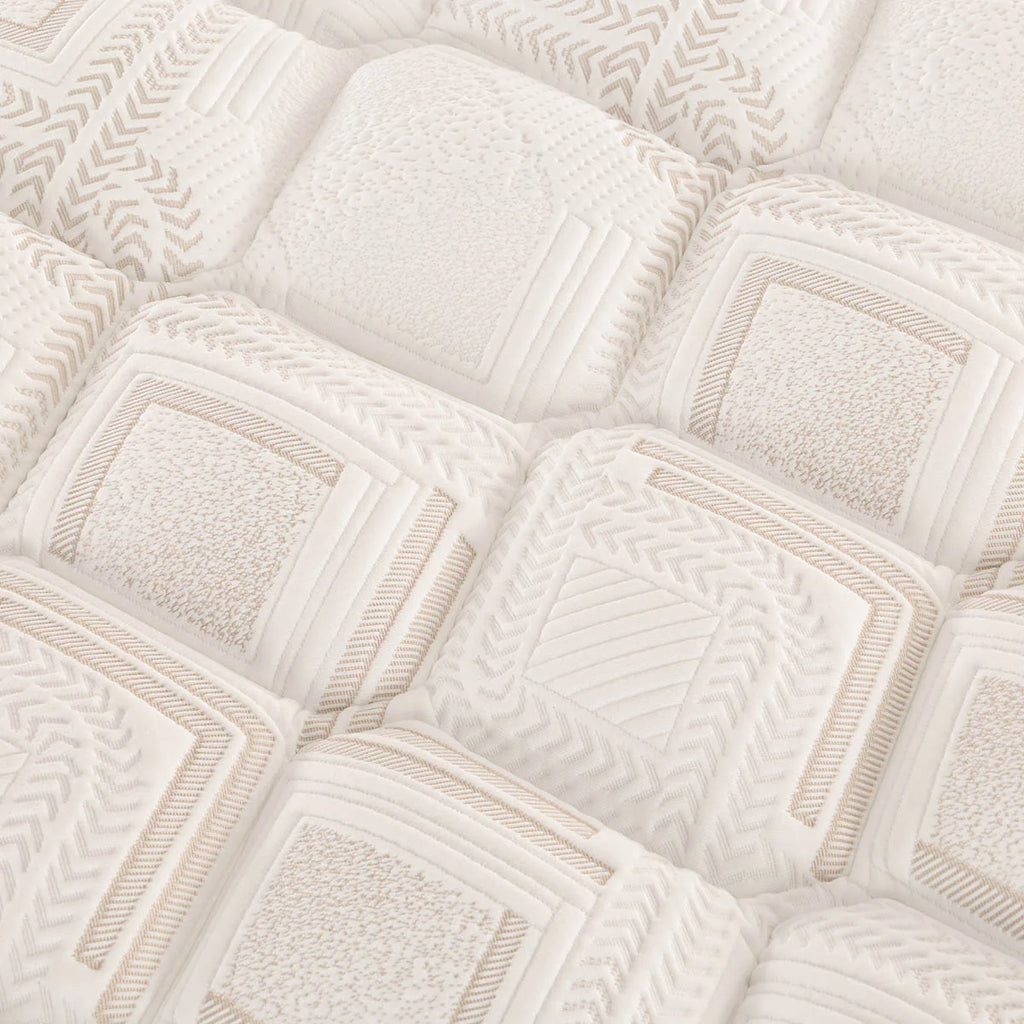 Close-up of a Sleepyhead mattress surface with geometric patterns.
