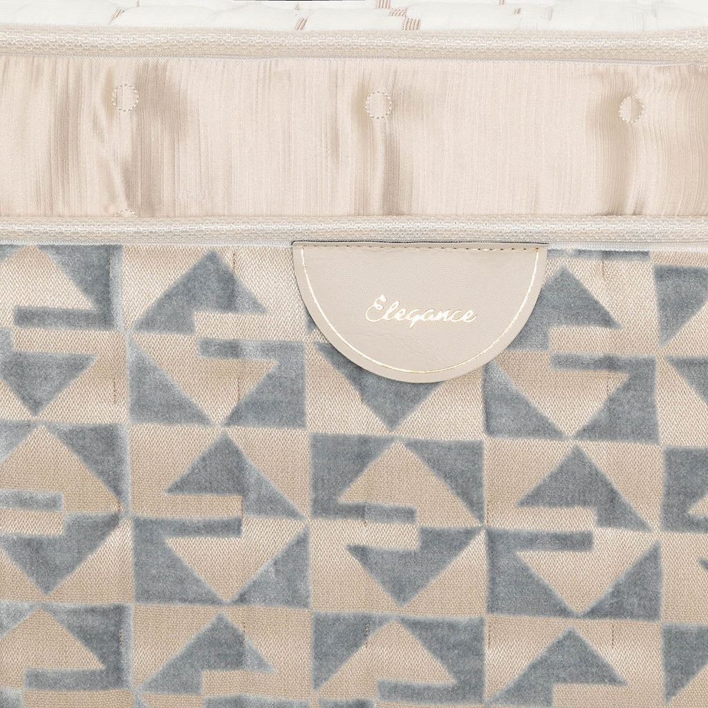 Patterned Sleepyhead mattress border with Elegance label.