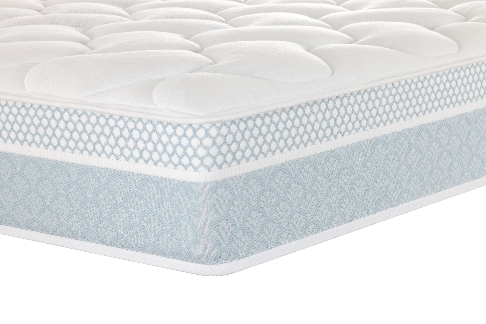 A close-up of a Sleepyhead mattress corner showing a white quilted top surface and a light blue patterned side skirt on a white background.