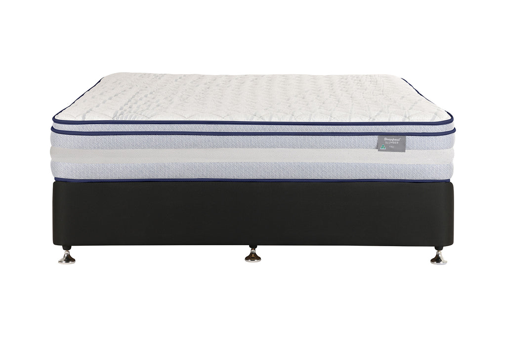 A Sleepyhead mattress on a black upholstered bed base with small metallic feet, photographed against a plain white background. The mattress has a white quilted top, blue piping accents, and a small side label.