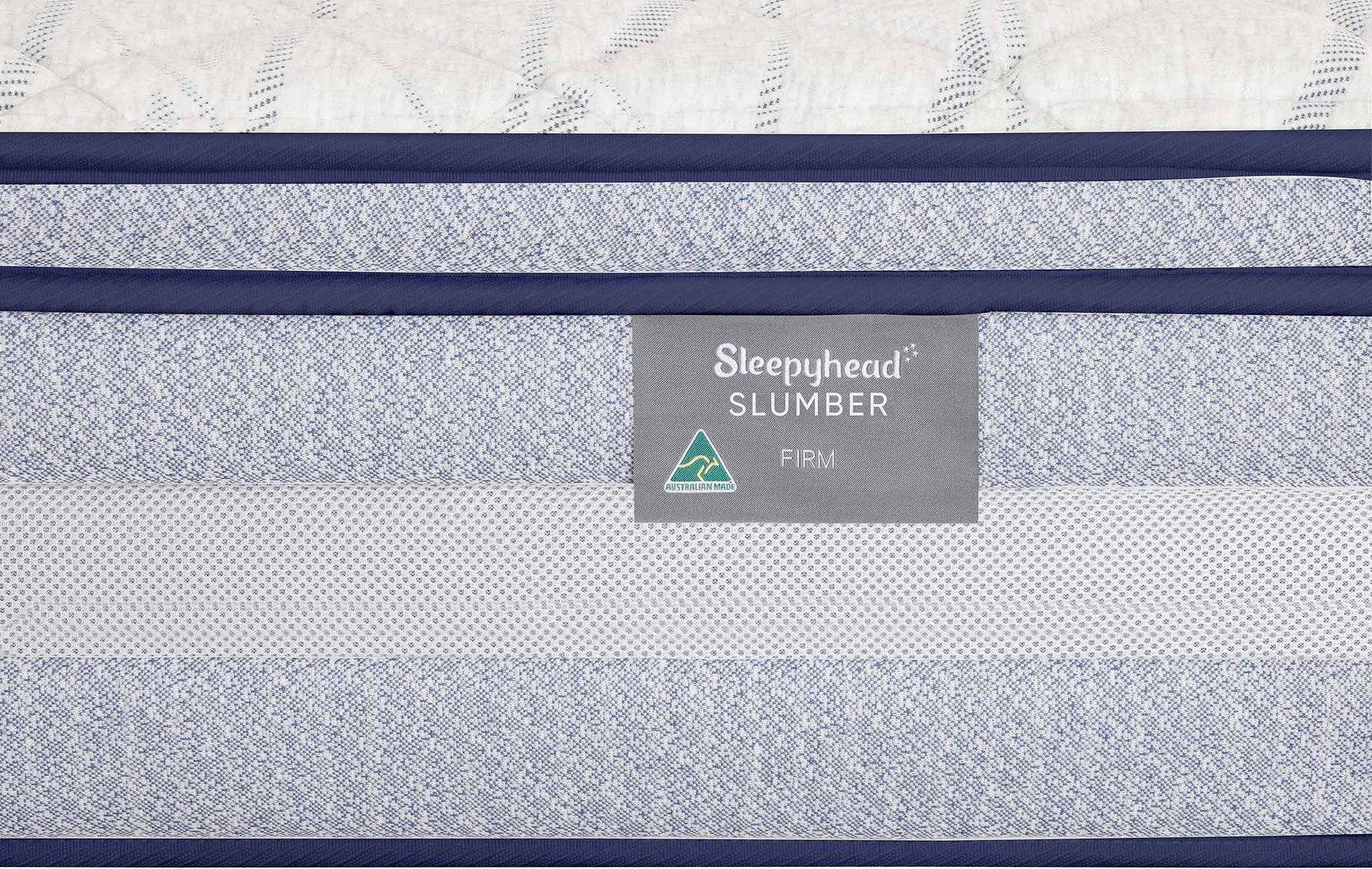 Close-up of a mattress side panel showing the Sleepyhead Slumber Firm label, with blue trim and a textured white mattress top visible.
