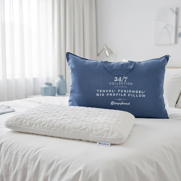 Blue Sleepyhead 24/7 Tencel FusionGel pillow bag on a bed in a bedroom setting