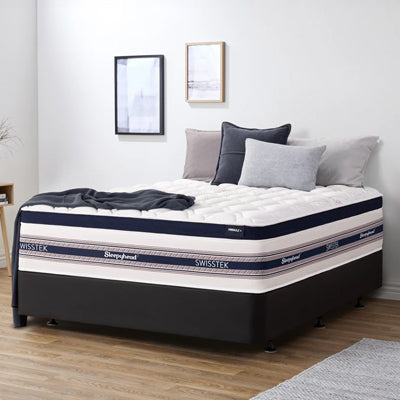 Sleepyhead Swisstek mattress in a bedroom setting with pillows and bedding.