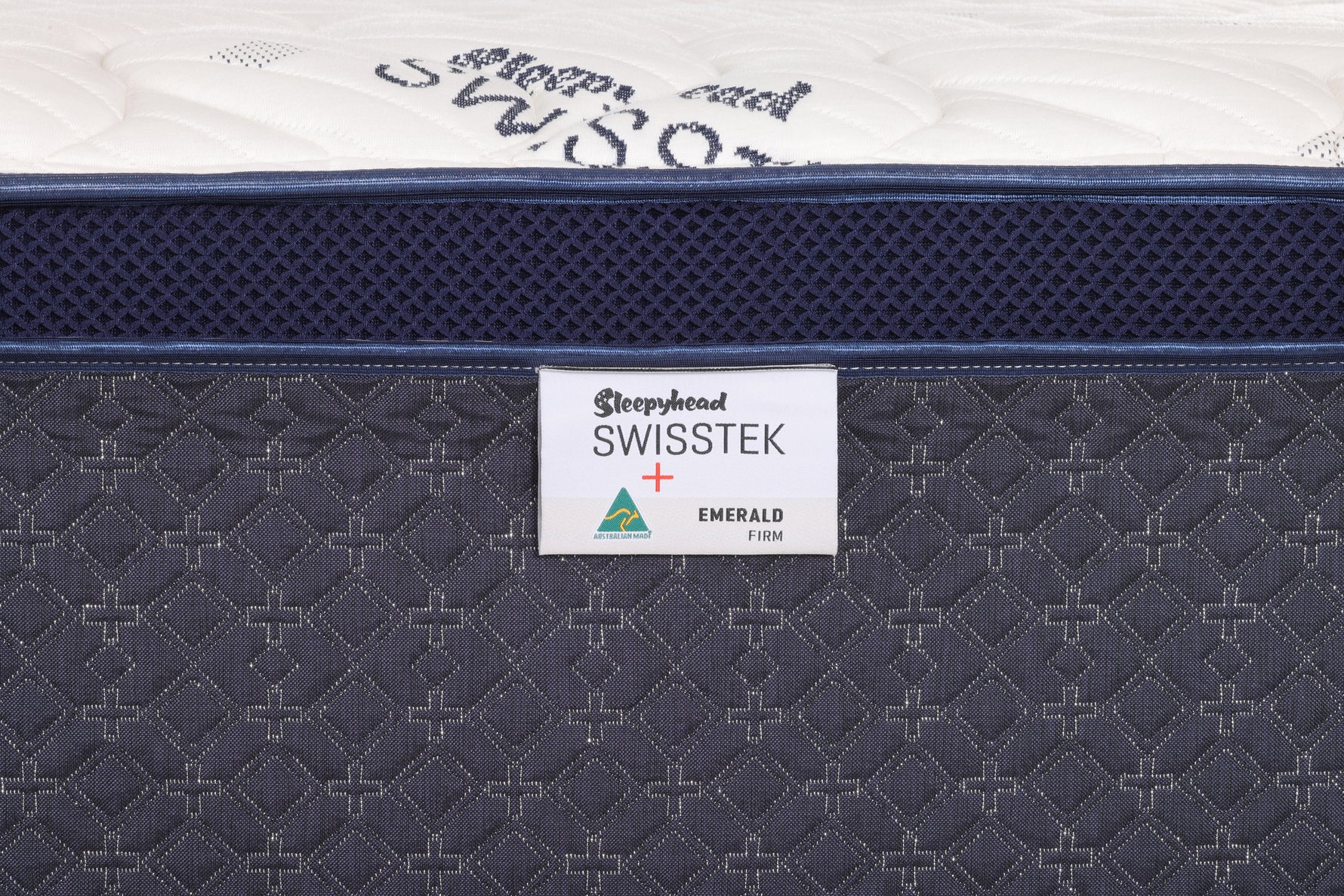 Close-up of a mattress with 'Sleepyhead Swisstek' branding on a white background