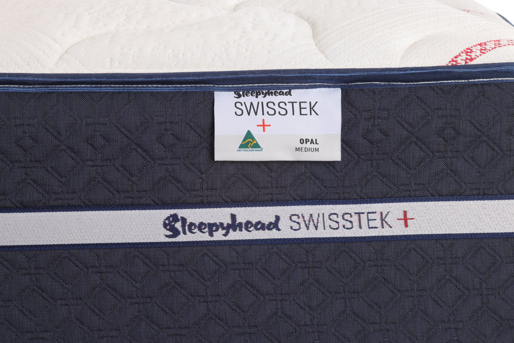 Close-up of a Sleepyhead Swisstek mattress with branding labels.